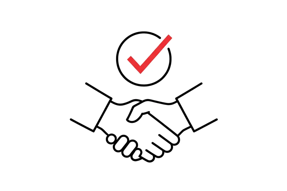 Zwei Hände geben sich zum erfolgreichen Geschäftsabschluss das Zeichen eines Handschlags.